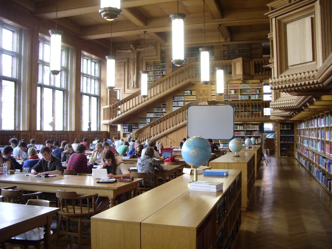 Wide view of attendees seated in rows during a professional knowledge exchange seminar in Belgium